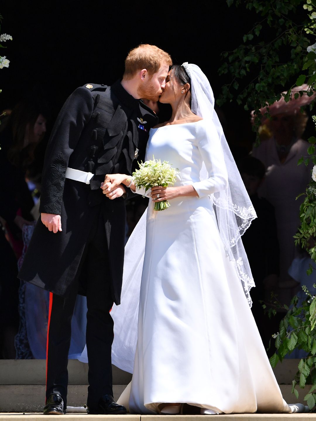 Newlyweds Prince Harry and Meghan Markle kiss following their wedding ceremony