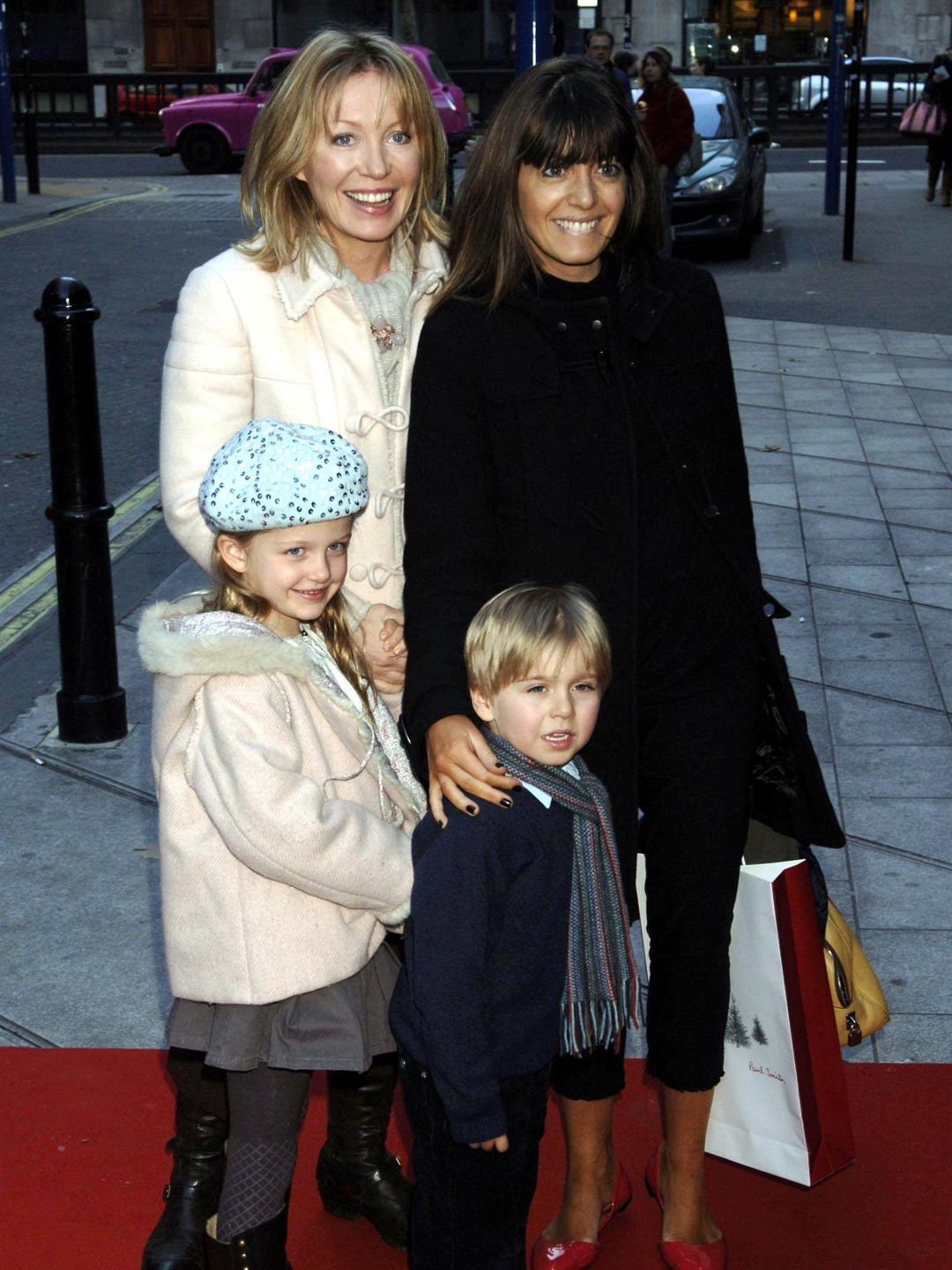 Kirsty Youngwith daughter Freya and Claudia Winkleman with son Jake arrive for the VIP press launch of The Snowman, at the Peacock Theatre in central London.