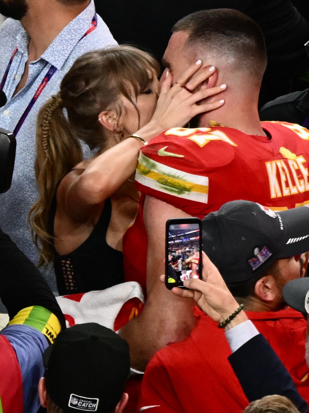 US singer-songwriter Taylor Swift kisses Kansas City Chiefs' tight end #87 Travis Kelce after the Chiefs won Super Bowl LVIII against the San Francisco 49ers at Allegiant Stadium in Las Vegas, Nevada, February 11, 2024. (Photo by Patrick T. Fallon / AFP) (Photo by PATRICK T. FALLON/AFP via Getty Images)