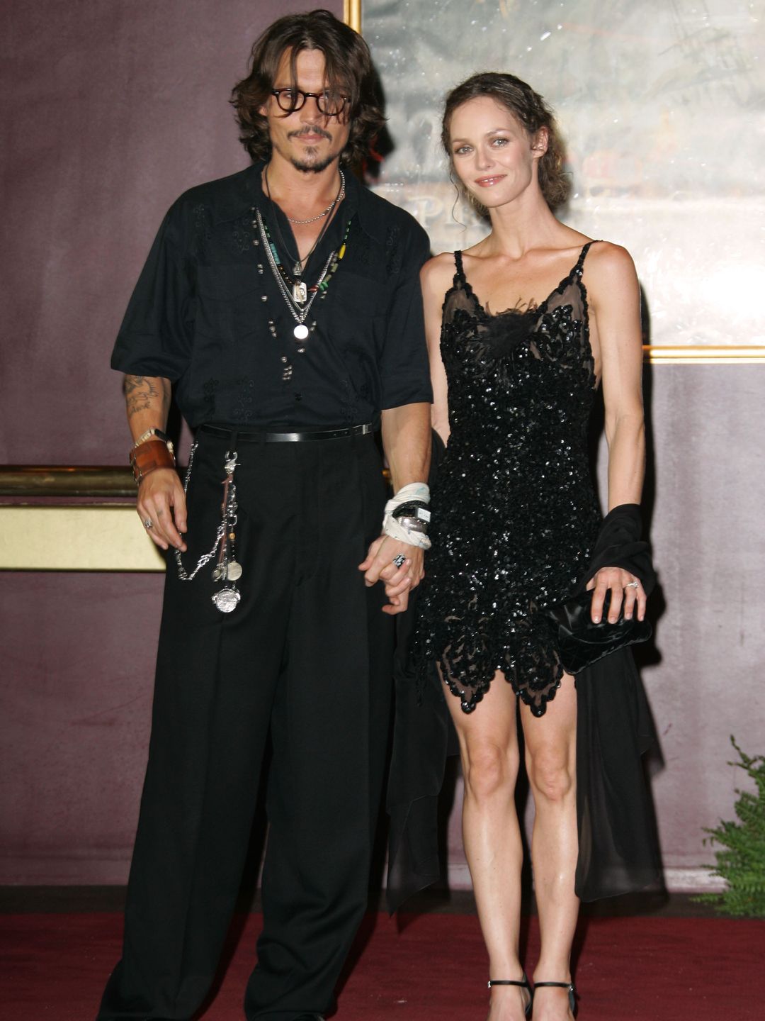 Johnny and Vanessa posing for a photo together at an event
