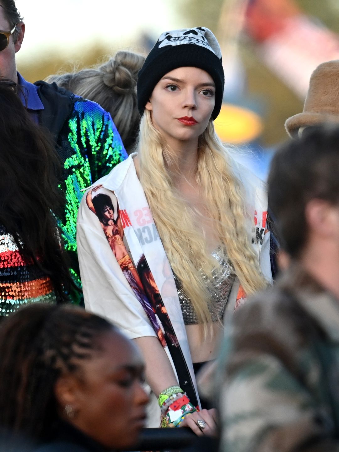 Anya Taylor-Joy wore a black beanie and white graphic shirt on Day five of Glastonbury.