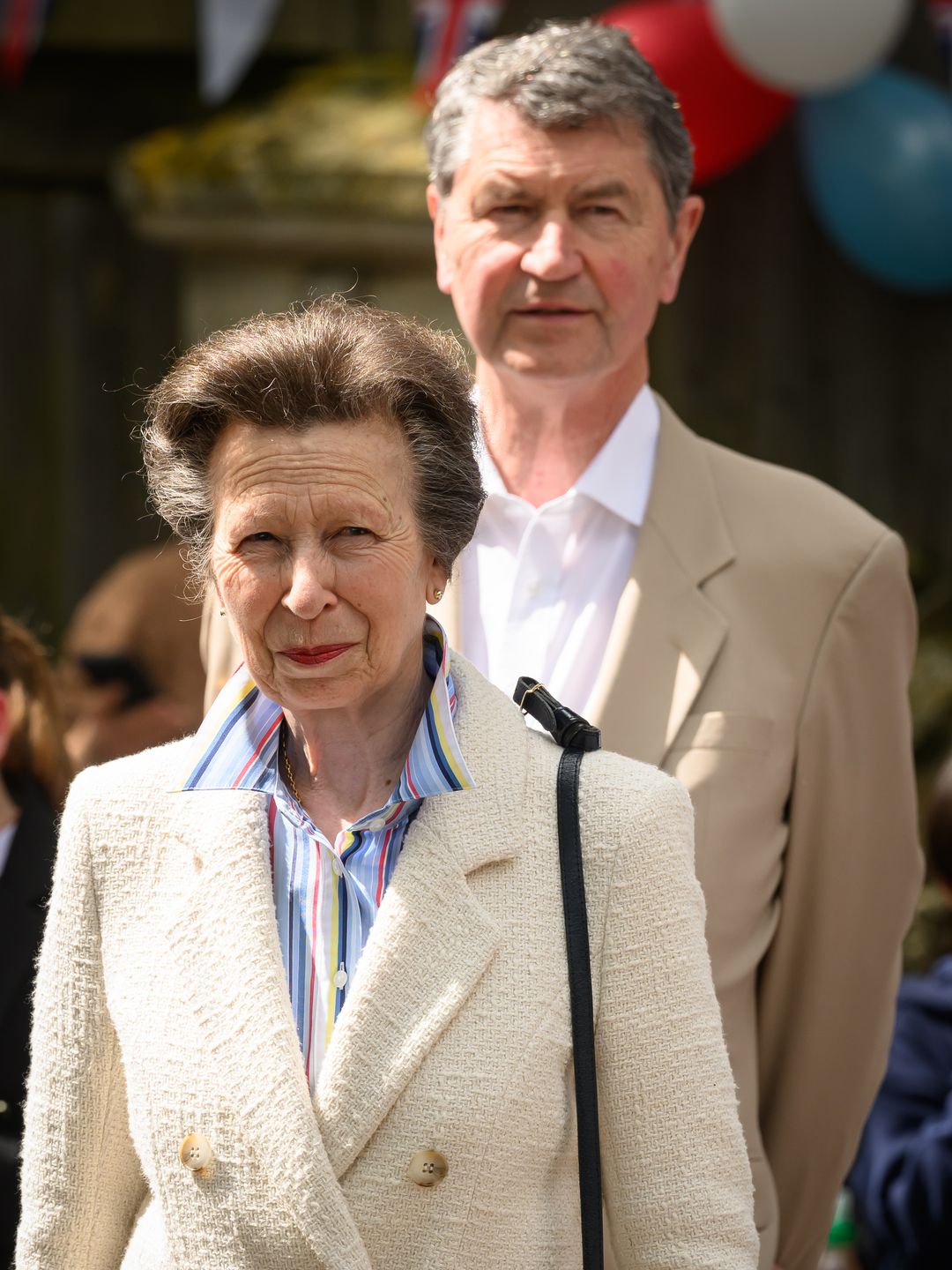 couple walking through street party