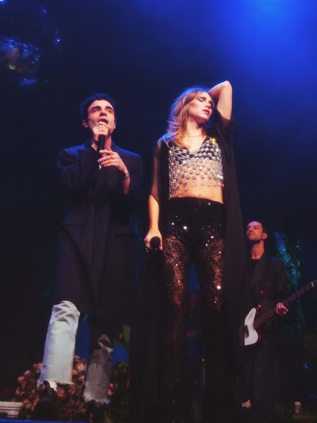 Suki Waterhouse performs on stage alongside Del Water Gap