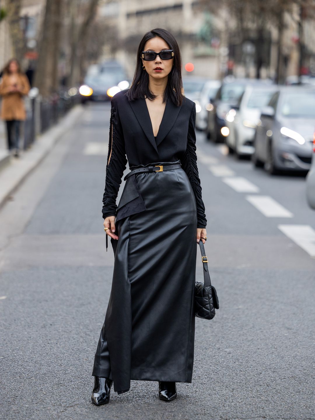 Woman wearing a leather maxi skirt 