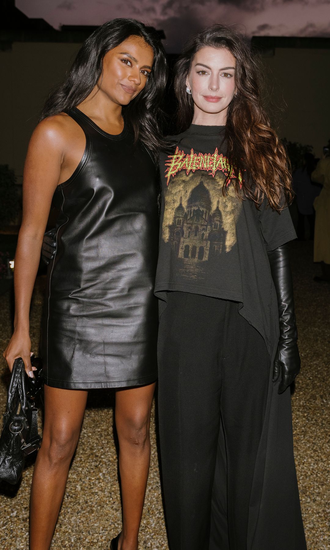 Simone Ashley and Anne Hathaway attend the Balenciaga Womenswear Spring/Summer 2026 show as part of Paris Fashion Week 