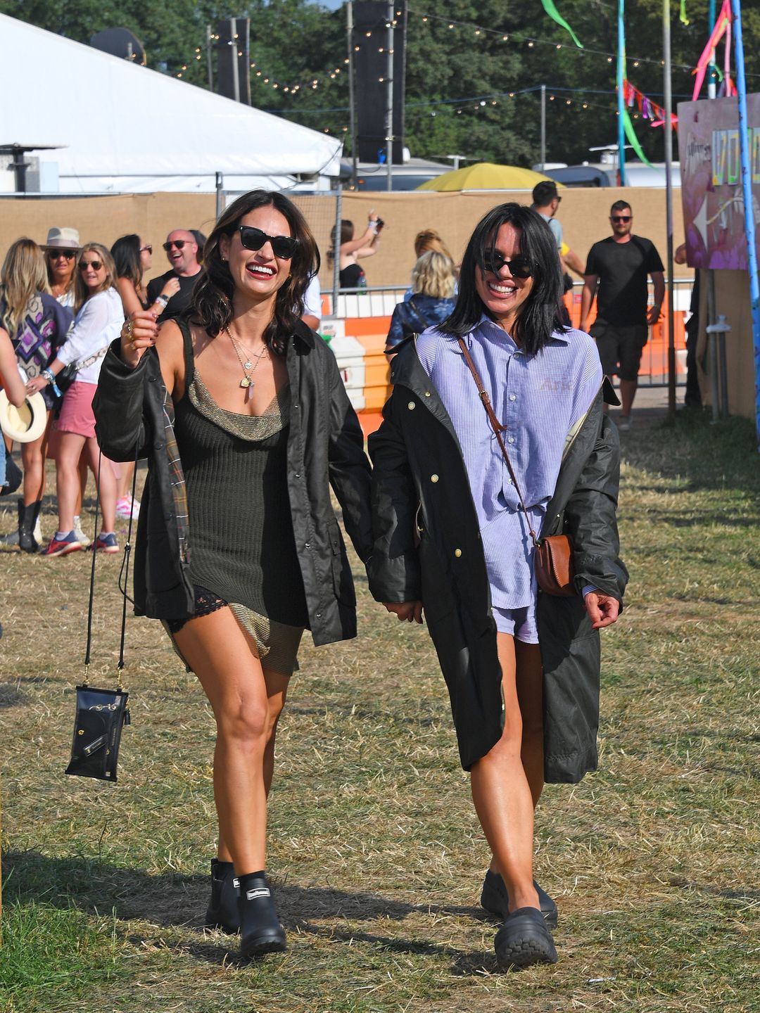 GLASTONBURY, ENGLAND - JUNE 23: Lily James and Billie Piper are seen on day one of the Glastonbury Festival wearing their Barbour wax jackets on June 23, 2023 in Glastonbury, England. (Photo by Dave Benett/Getty Images)