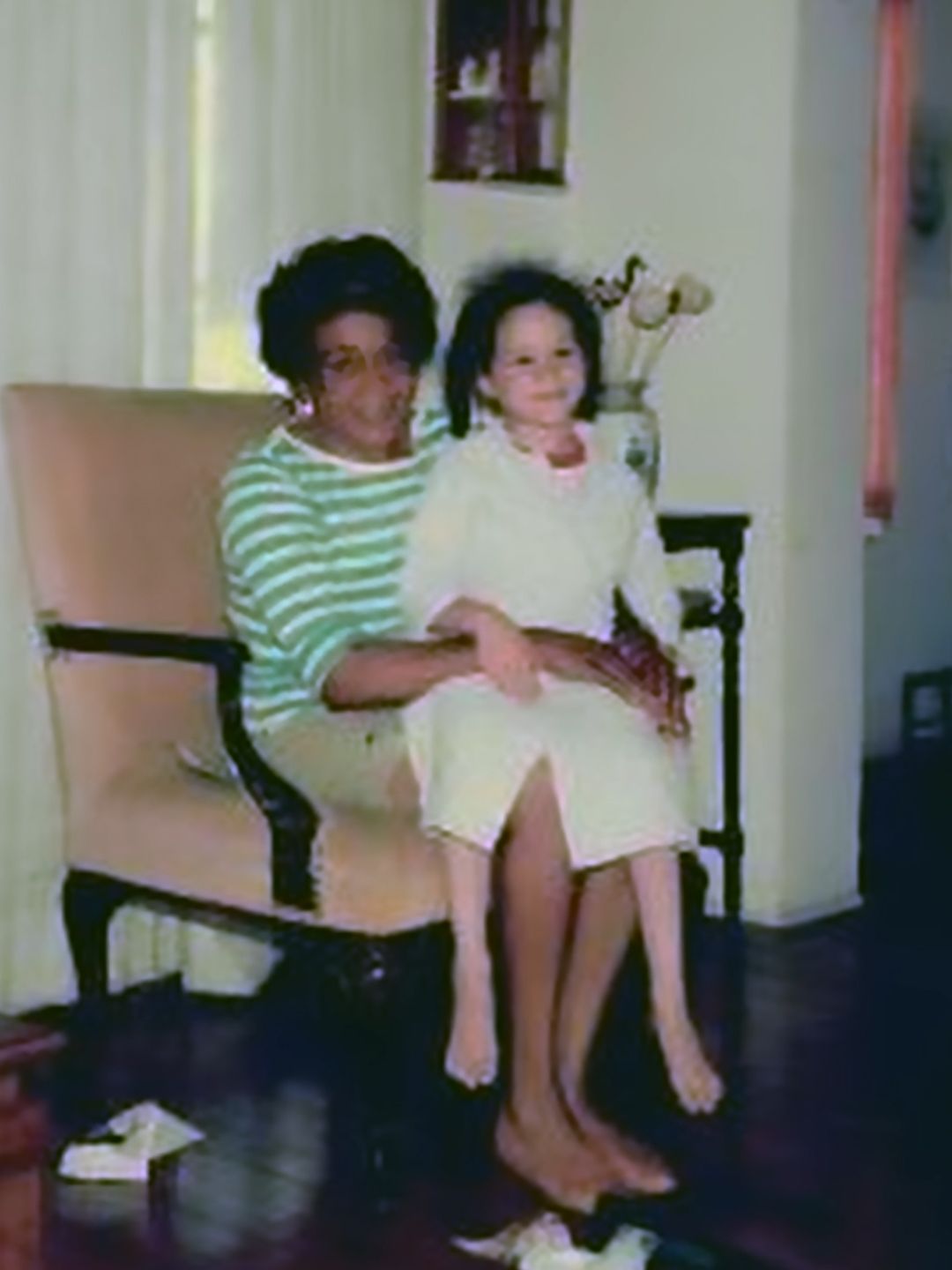 A young Meghan Markle sat on her grandmother's knee