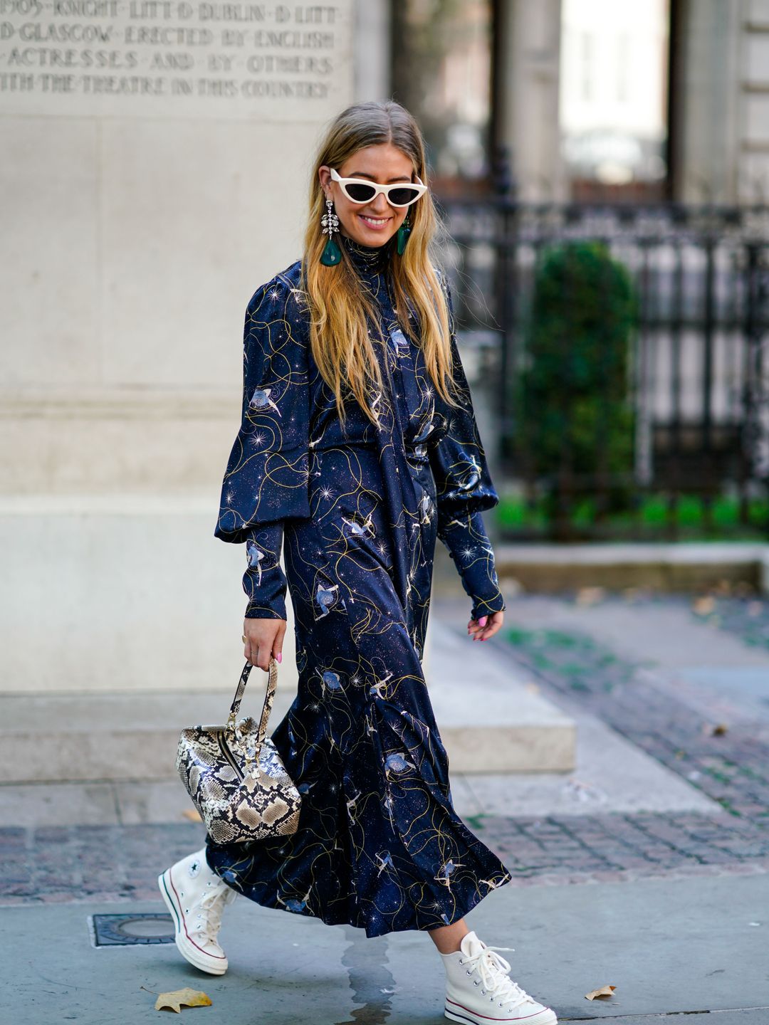 Emili Sindlev rocks a navy patterned midi with high tops 