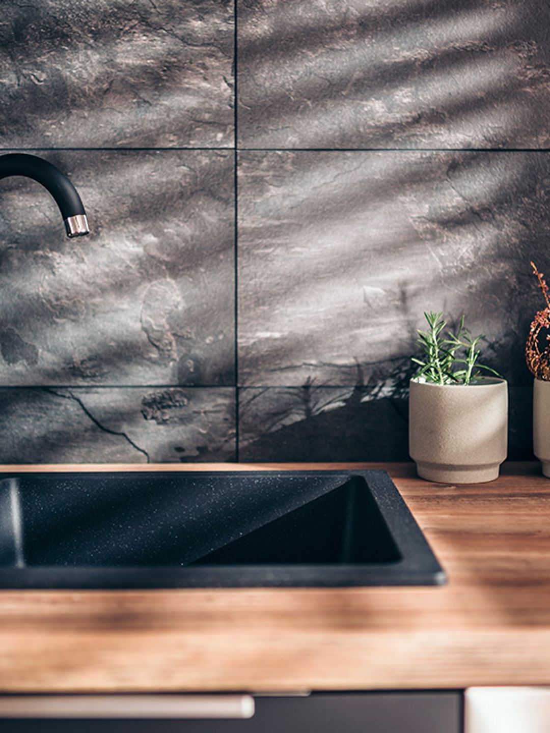 A clean black kitchen sink