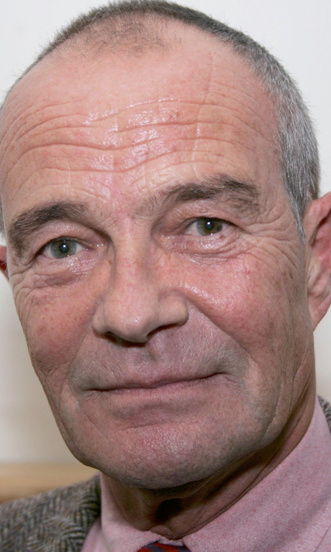 David Griffin in front of a white background