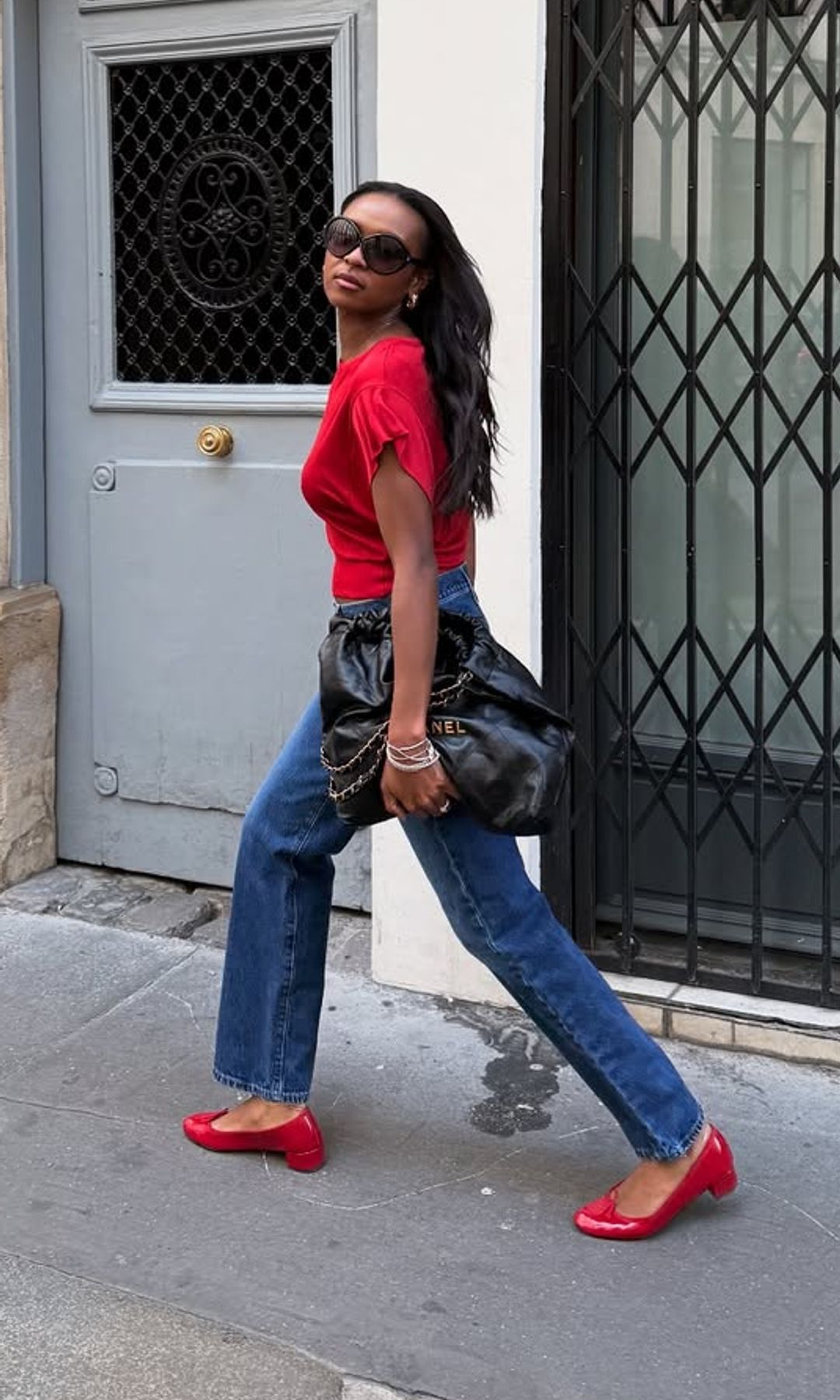 @devapollon in jeans and red shoes