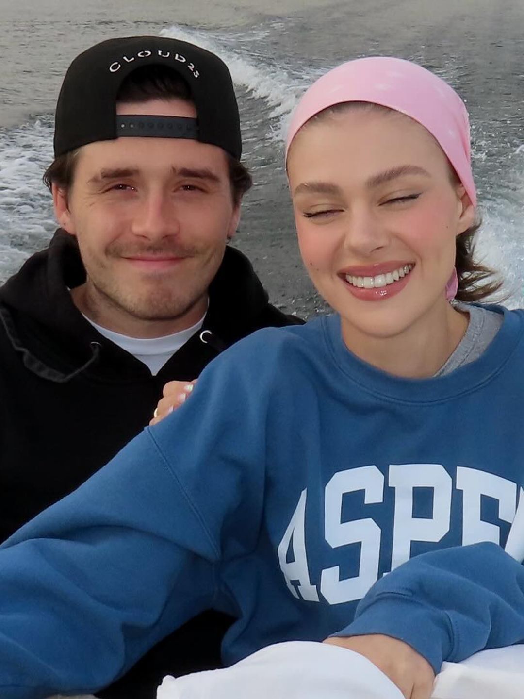 Nicola and Brookyln Beckham pose for a selfie on a boat