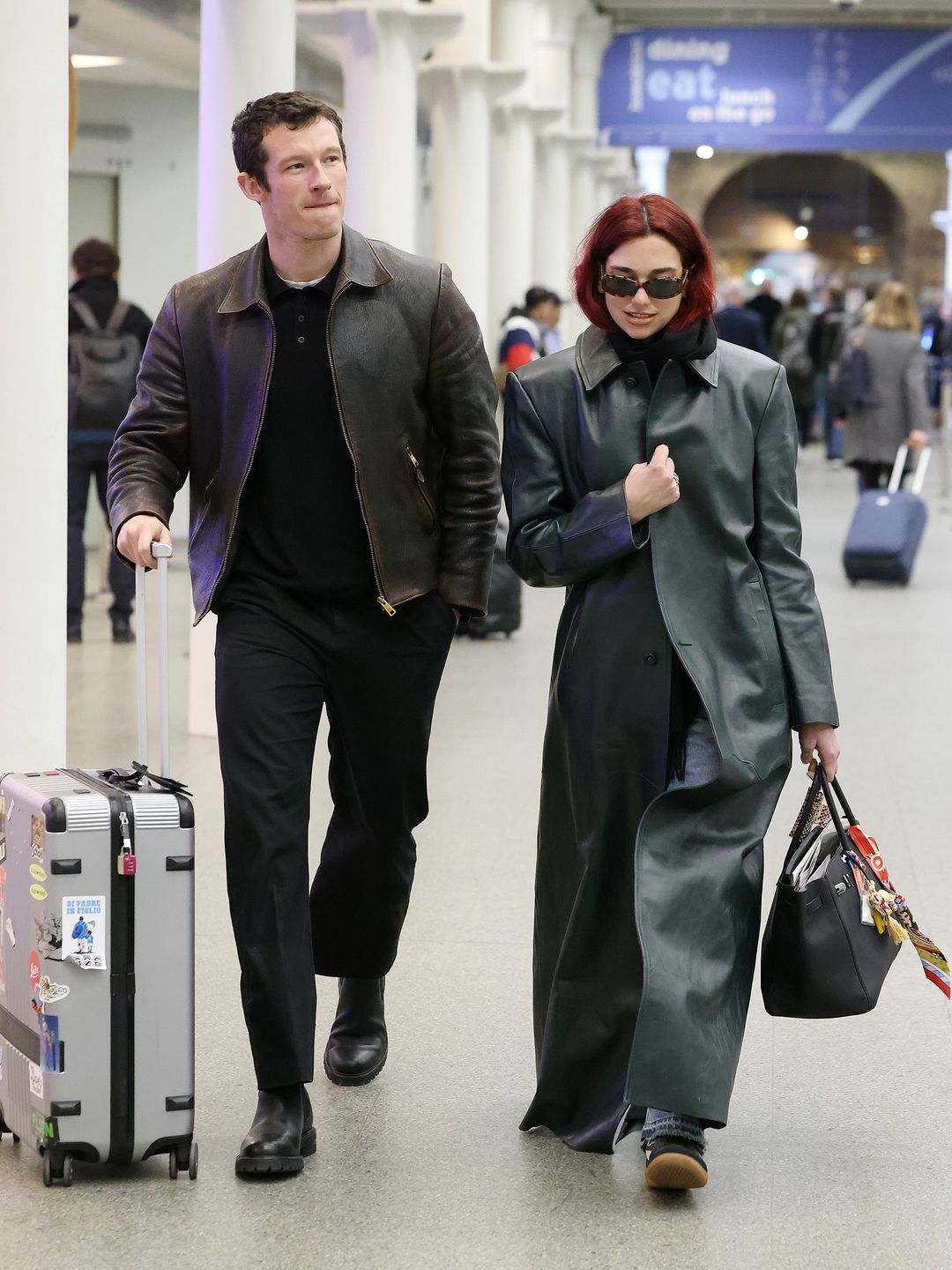 Dua Lipa and Callum Turner arriving at London St Pancras Station after taking the Eurostar from Paris