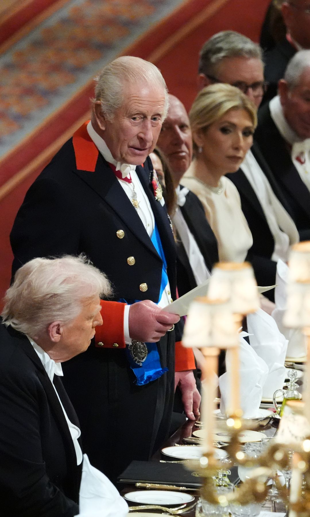 King Charles giving a speech with Donald Trump sitting next t o him