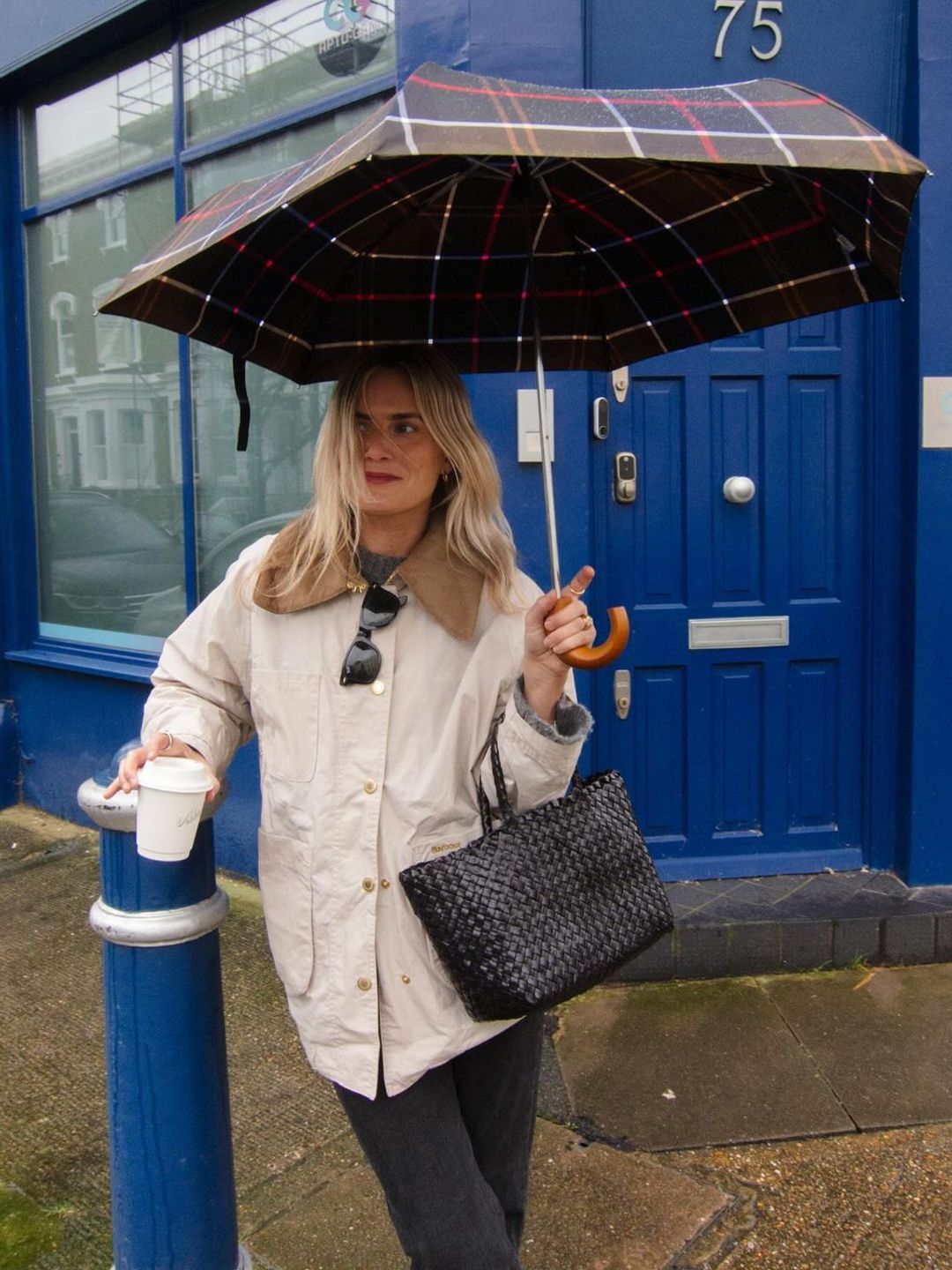 Hiding from the rain in a Barbour barn jacket 