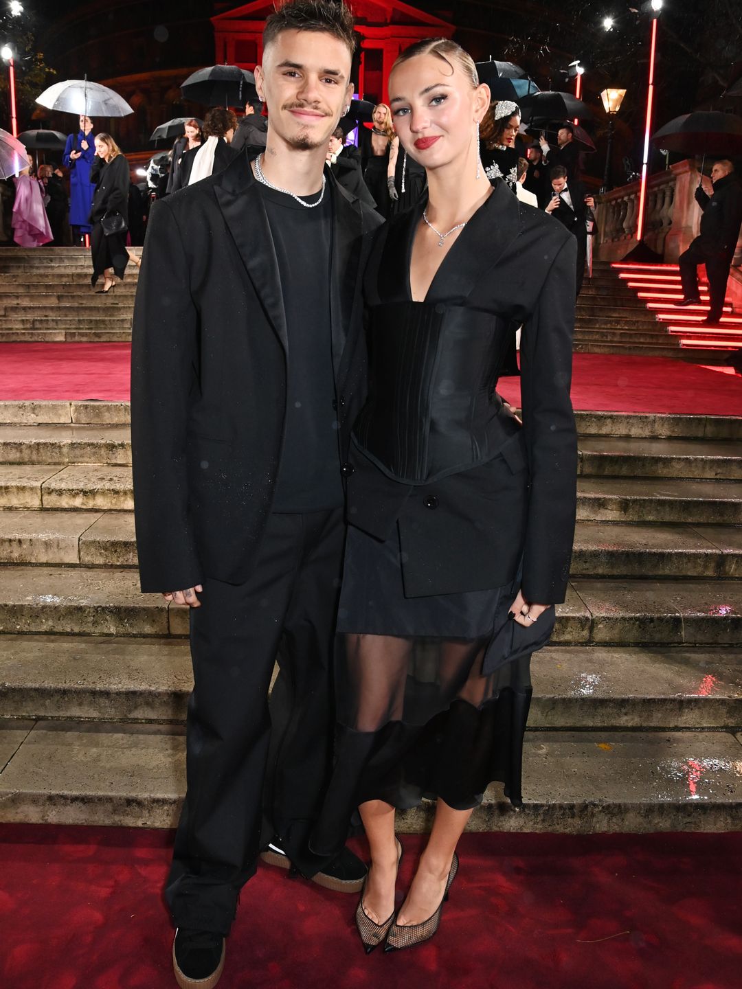 Mia Regan and Romeo Beckham rocking all-black outfits at the event 