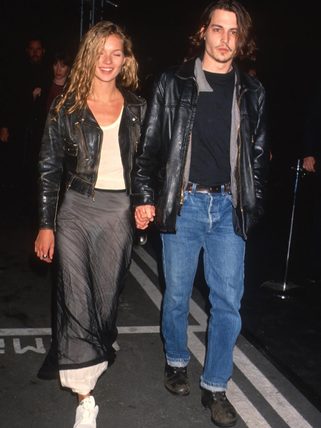 Kate Moss walks hand in hand with Johnny Depp  wearingmatching leather jackets in 1994
