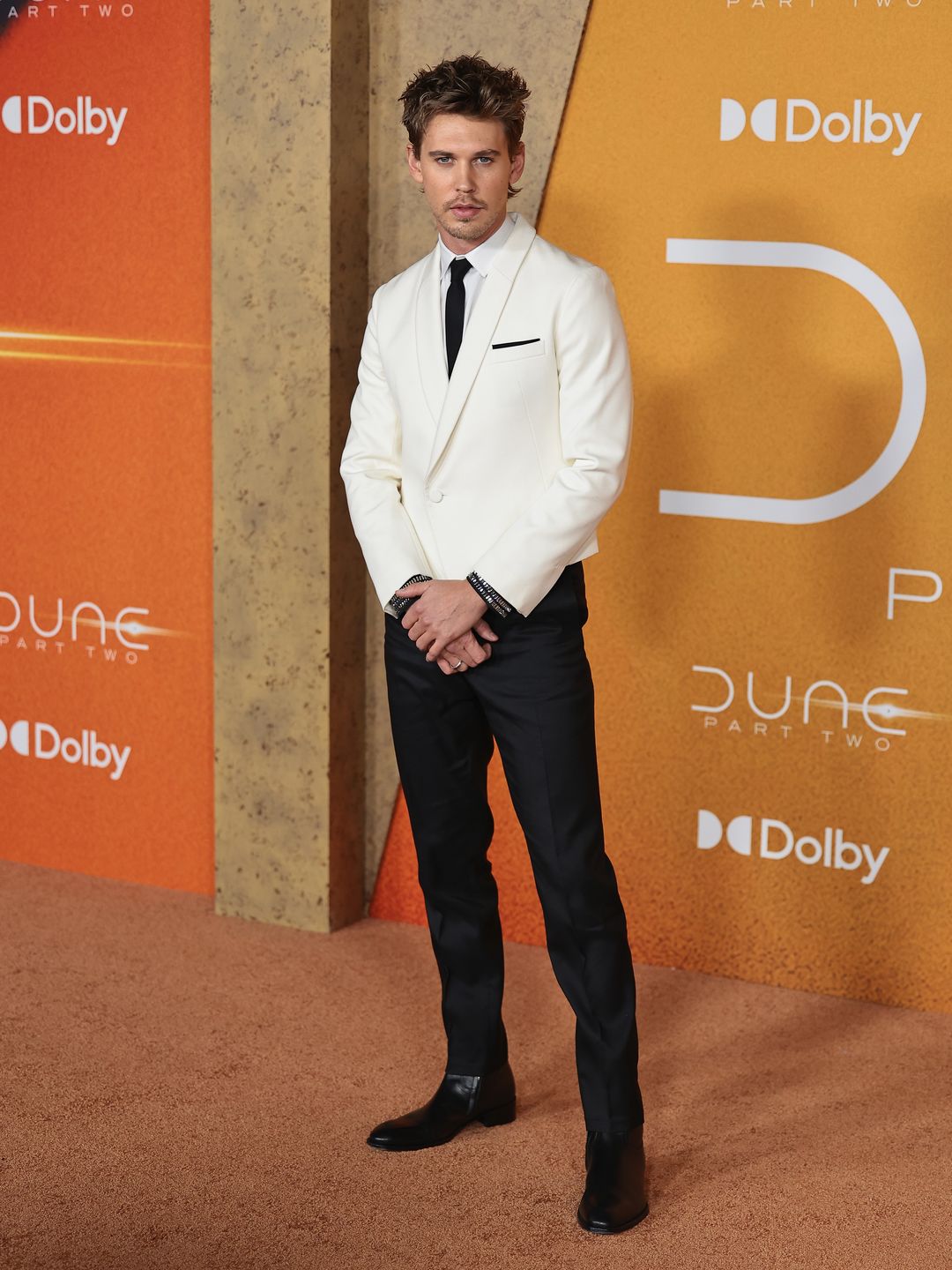 Austin Butler attends the "Dune: Part Two" premiere at Lincoln Center on February 25 wearing a white blazer and black torusers