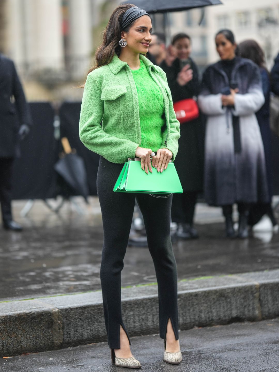 Jessica Kahawaty wears a fluffy green knit with split-hem leggings 
