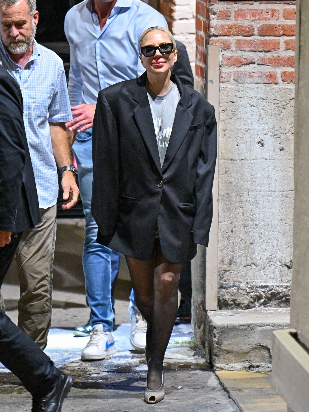  Lady Gaga is seen leaving 'Jimmy Kimmel Live!' on October 01, 2024 in Los Angeles, California wearing a blazer, heels and tights