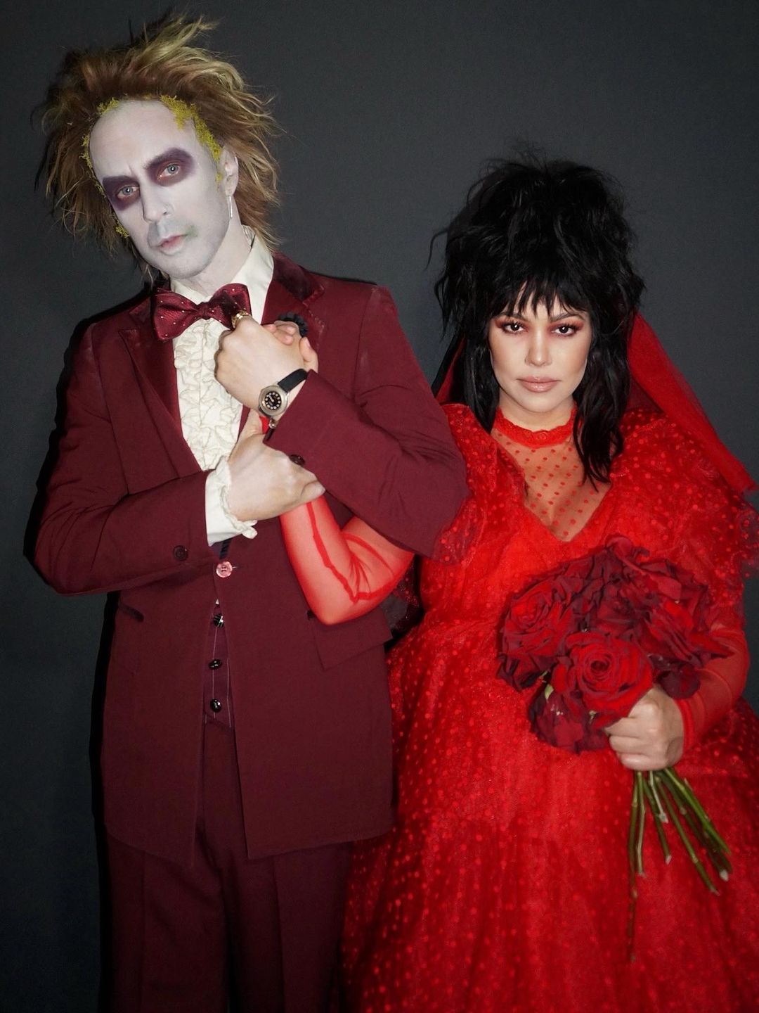 Kourtney Kardashian and Travis barker dressed as Beetlejuice and Lydia for Halloween last year