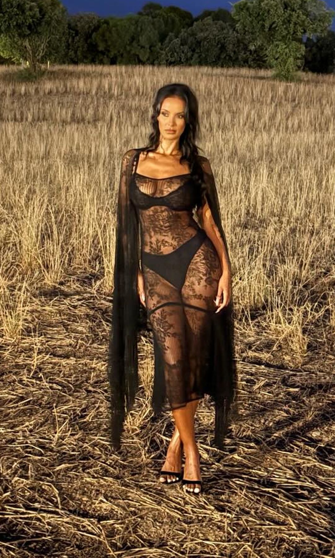 Maya Jama poses for a photo in a black sheer dress
