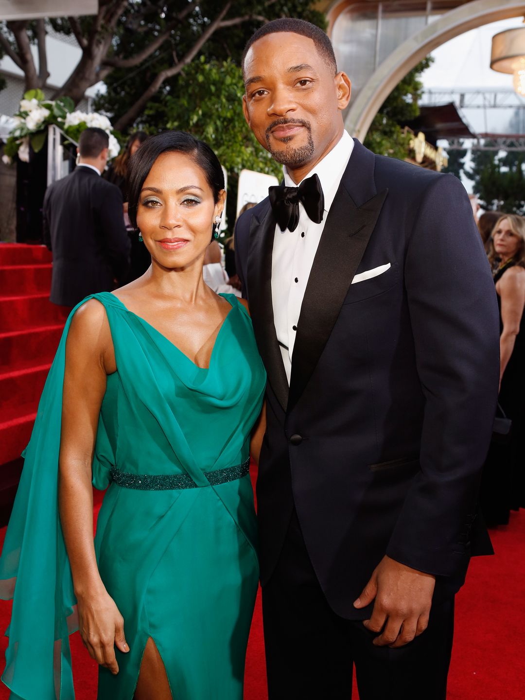 Jada Pinkett Smith and Will Smith smiling at a red carpet events
