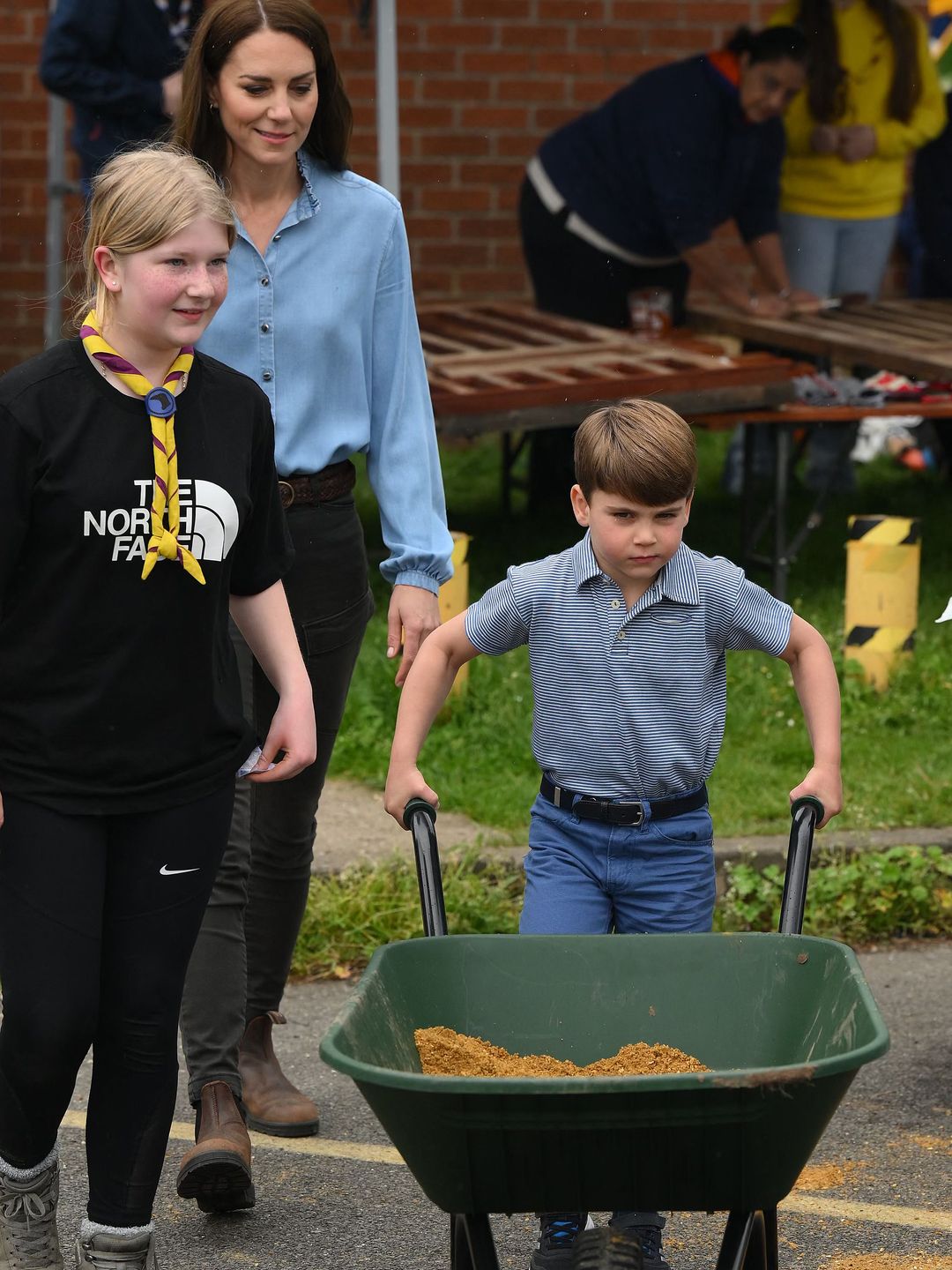 Prince Louis took control of a wheelbarrow as he helped his mother  take part in the Big Help Out  during a visit to the 3rd Upton Scouts Hut in Slough