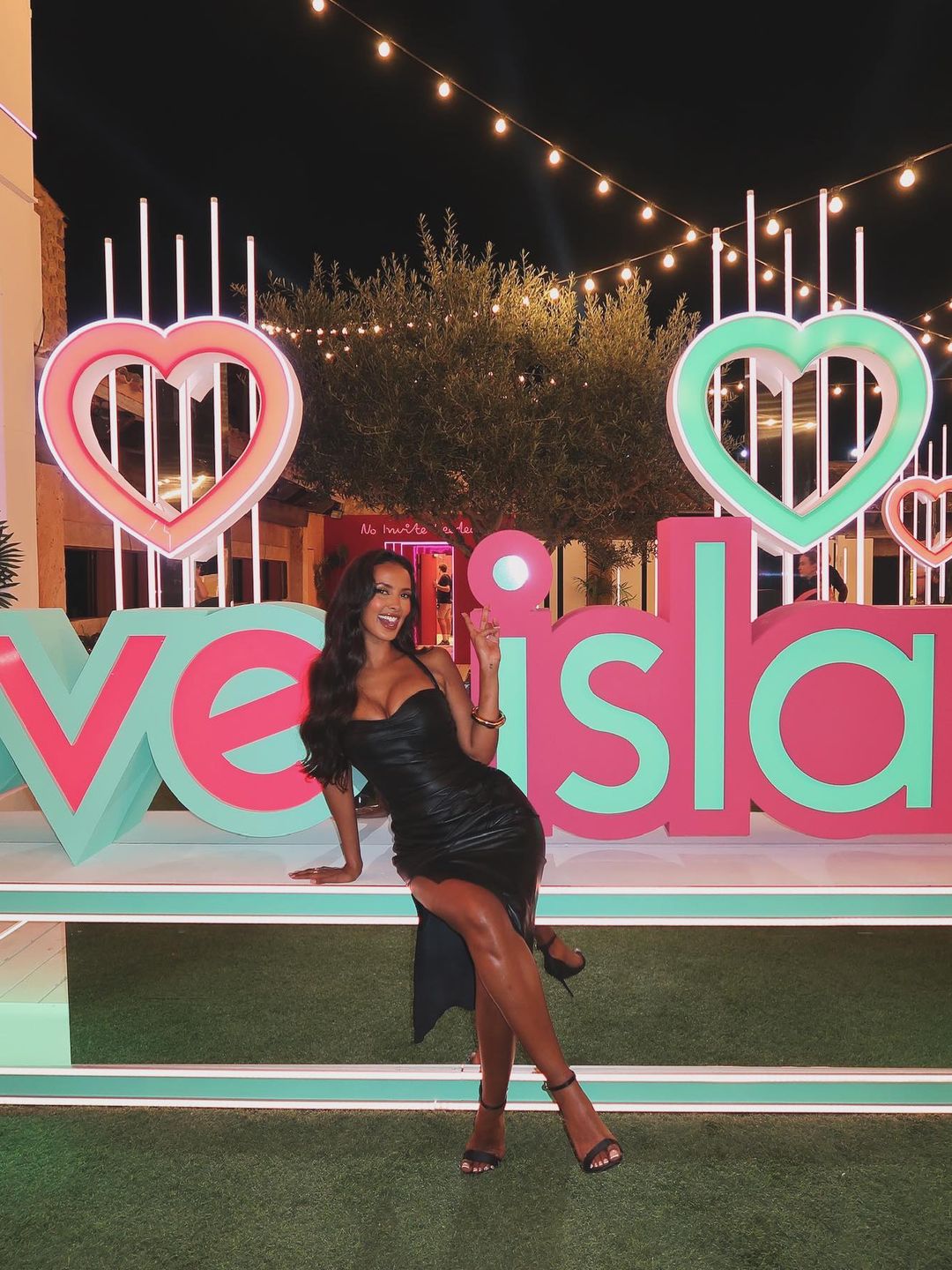 Maya Jama poses on the Love Island set