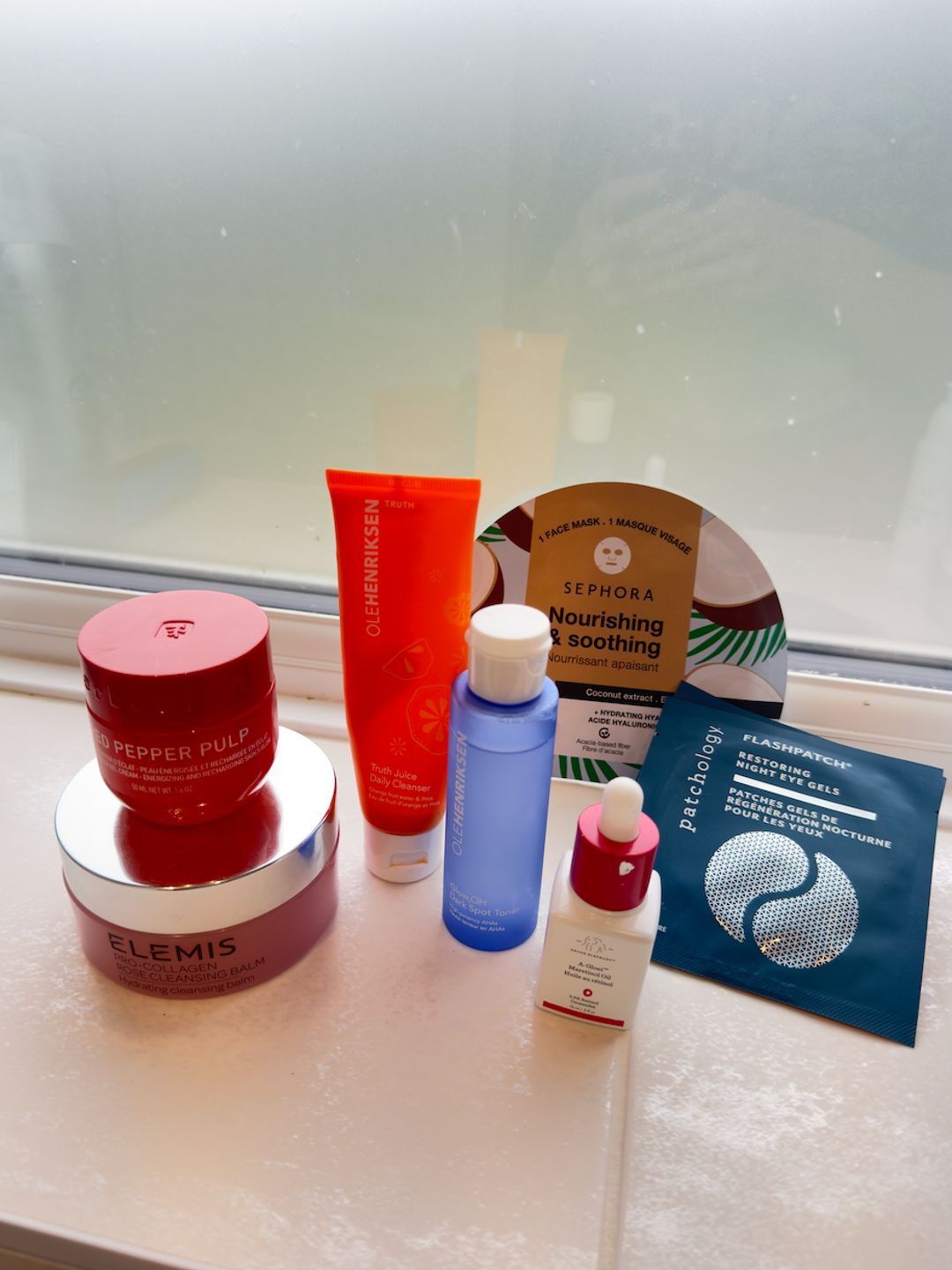 Lucy's Evening Skincare Routine Products on her Window Sill 