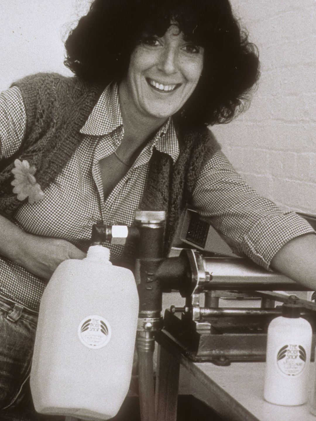 Dame Anita Roddick poses in the first The Body Shop factory