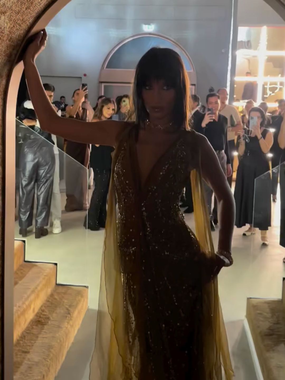 Bella Hadid poses in a yellow-toned sheer dress while in Dubai