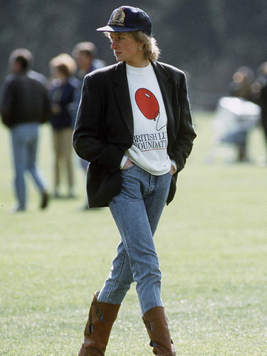 Diana, Princess Of Wales At Guards Polo Club. The Princess was Casually Dressed In A Sweatshirt With The British Lung Foundation Logo On The Front, Jeans, Boots And A Baseball Cap.  
