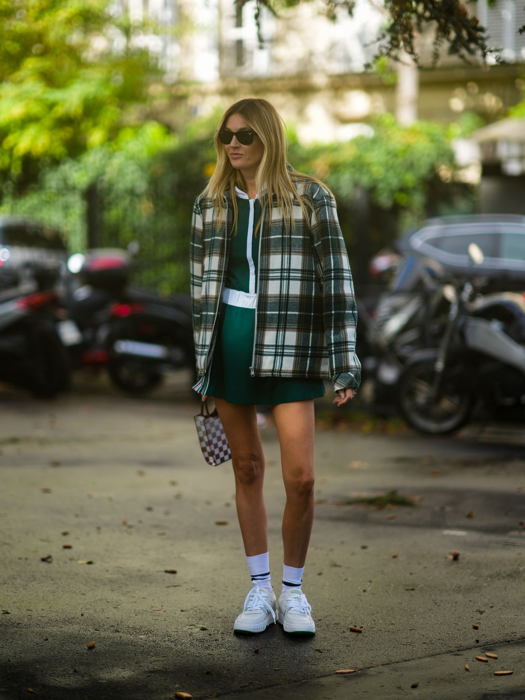 Camille Charrière rocks a sporty green mini with white platforms 