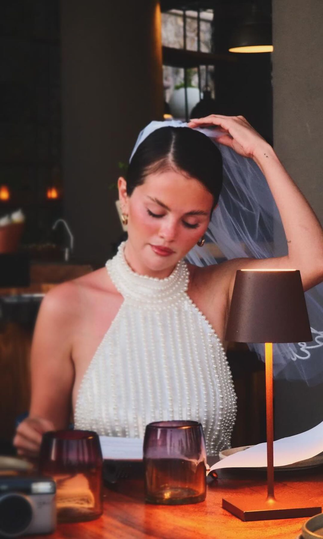 Selena Gomez wears a white beaded dress to dinner 