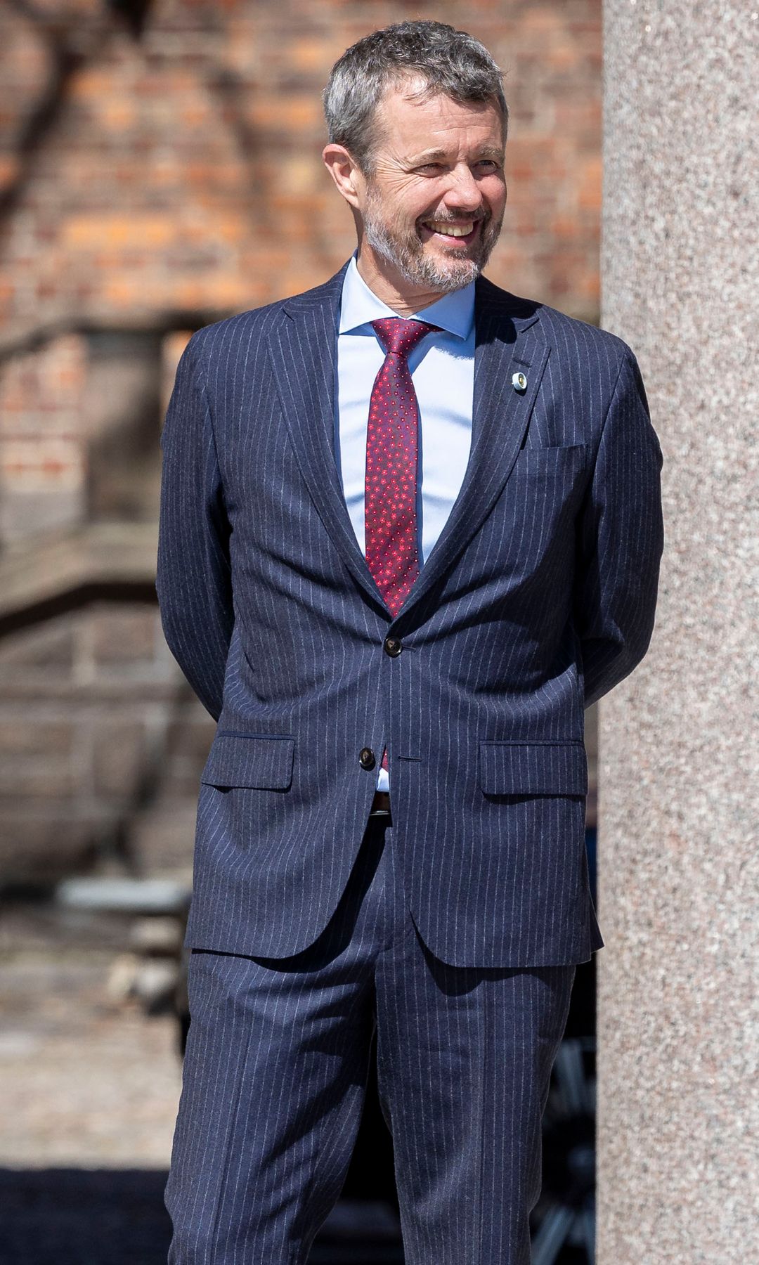 King Frederik in a blue pinstripe suit