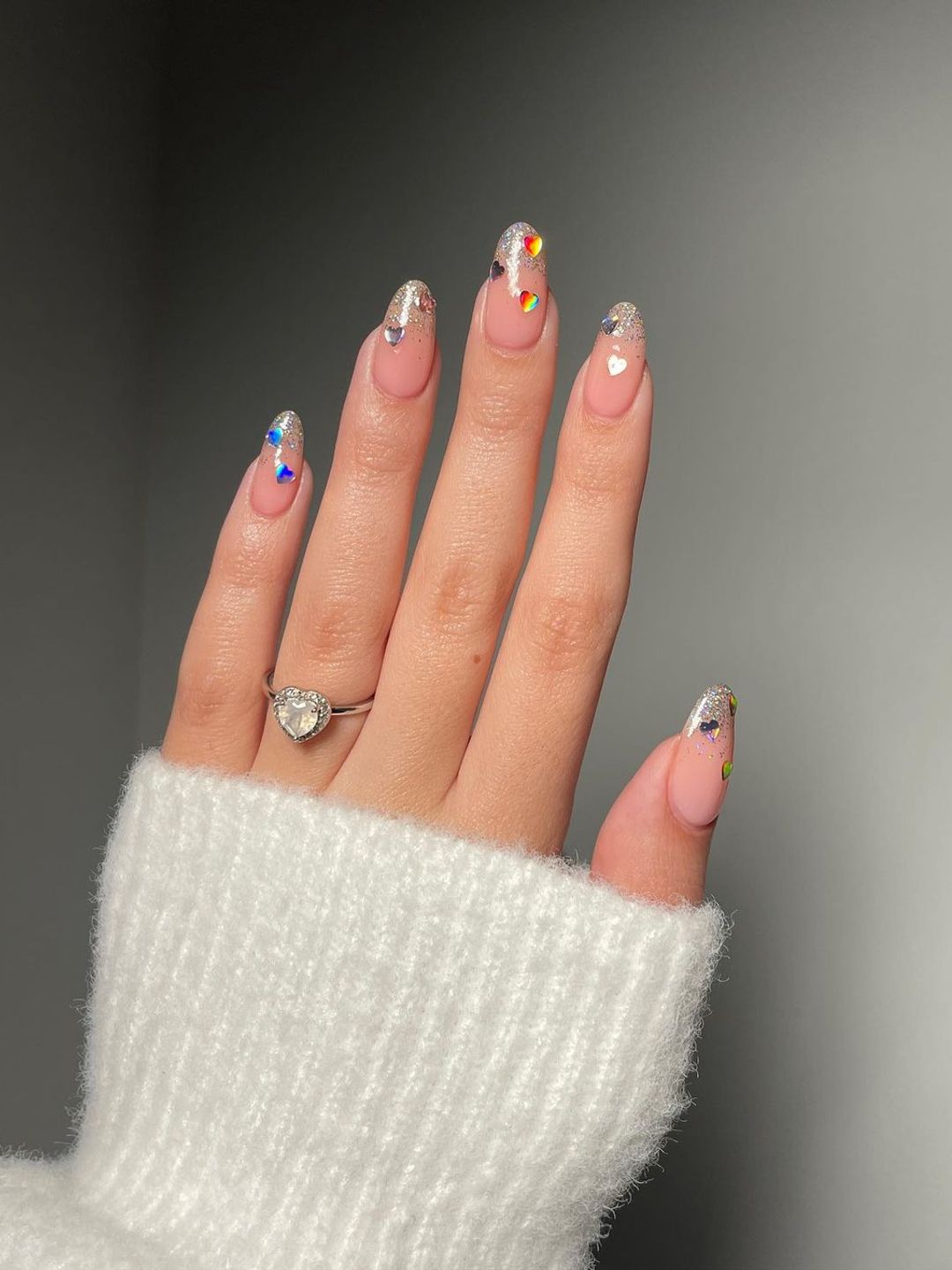 Nails with silver glitter and heart gems 