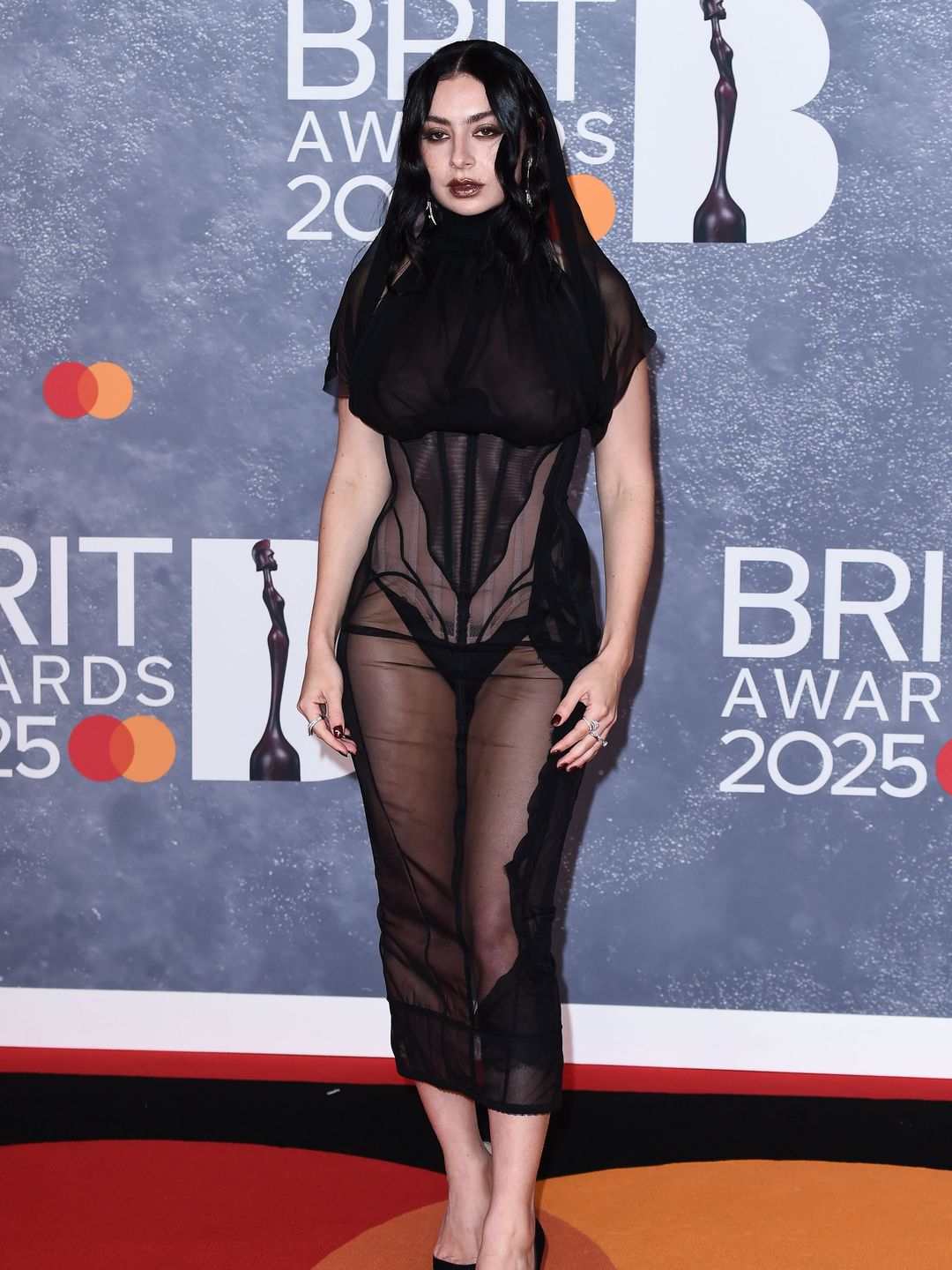 Charli XCX in a black sheer outfit