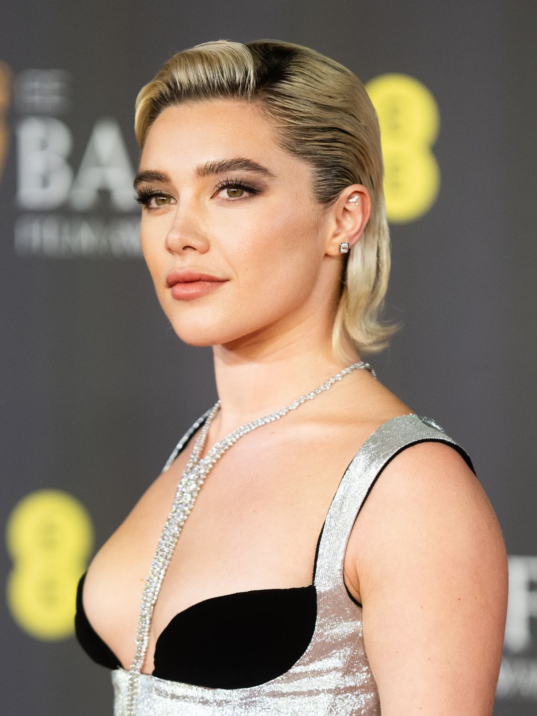 Florence slicked back her strands at the Bafta's back on the red carpet in February 