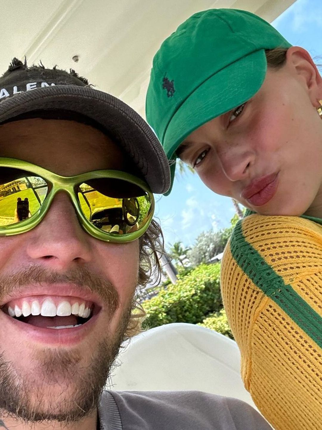 The duo matched in green accessories during their luxurious tropical getaway