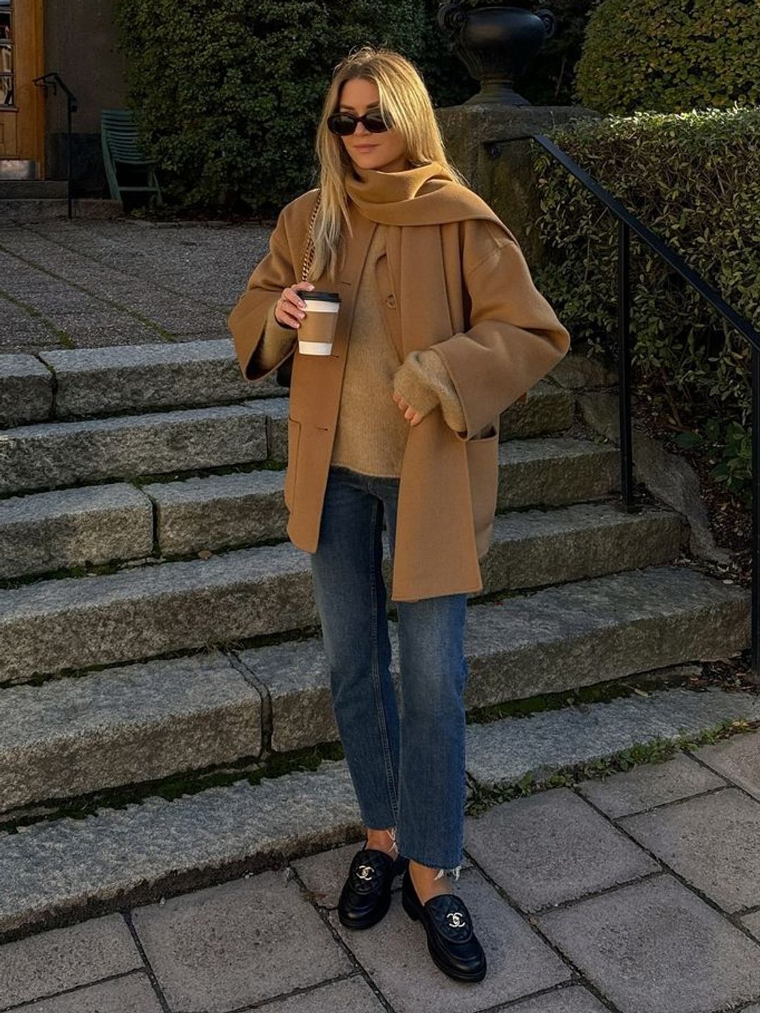 model with straight-leg jeans and black loafers