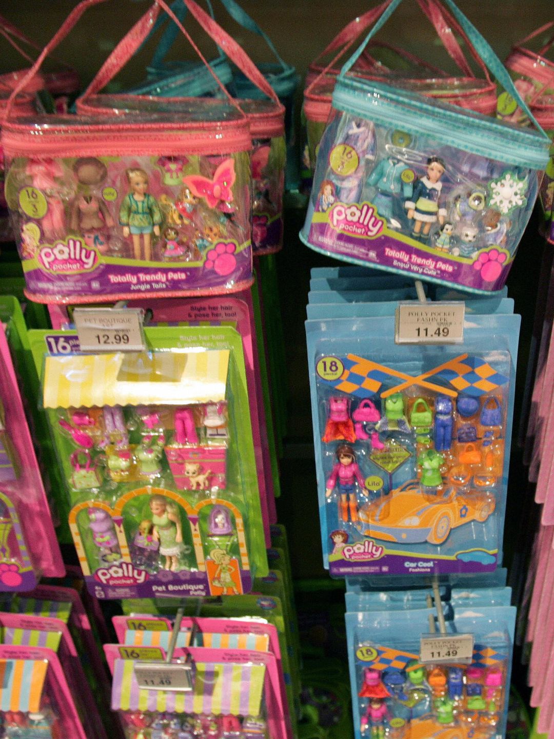 Polly Pocket toys hang on display in a Manhattan toy store 14 August, 2007 in New York.  Mattel on Tuesday announced it was recalling more than 18 million Chinese-made toys worldwide, including nine million in the United States, citing injuries to at least three children who swallowed small magnets that had broken loose. If swallowed, the magnets could attract each other and cause intestinal perforation, infection or blockage, which can be fatal.   AFP PHOTO DON EMMERT/dre (Photo credit should read DON EMMERT/AFP via Getty Images)