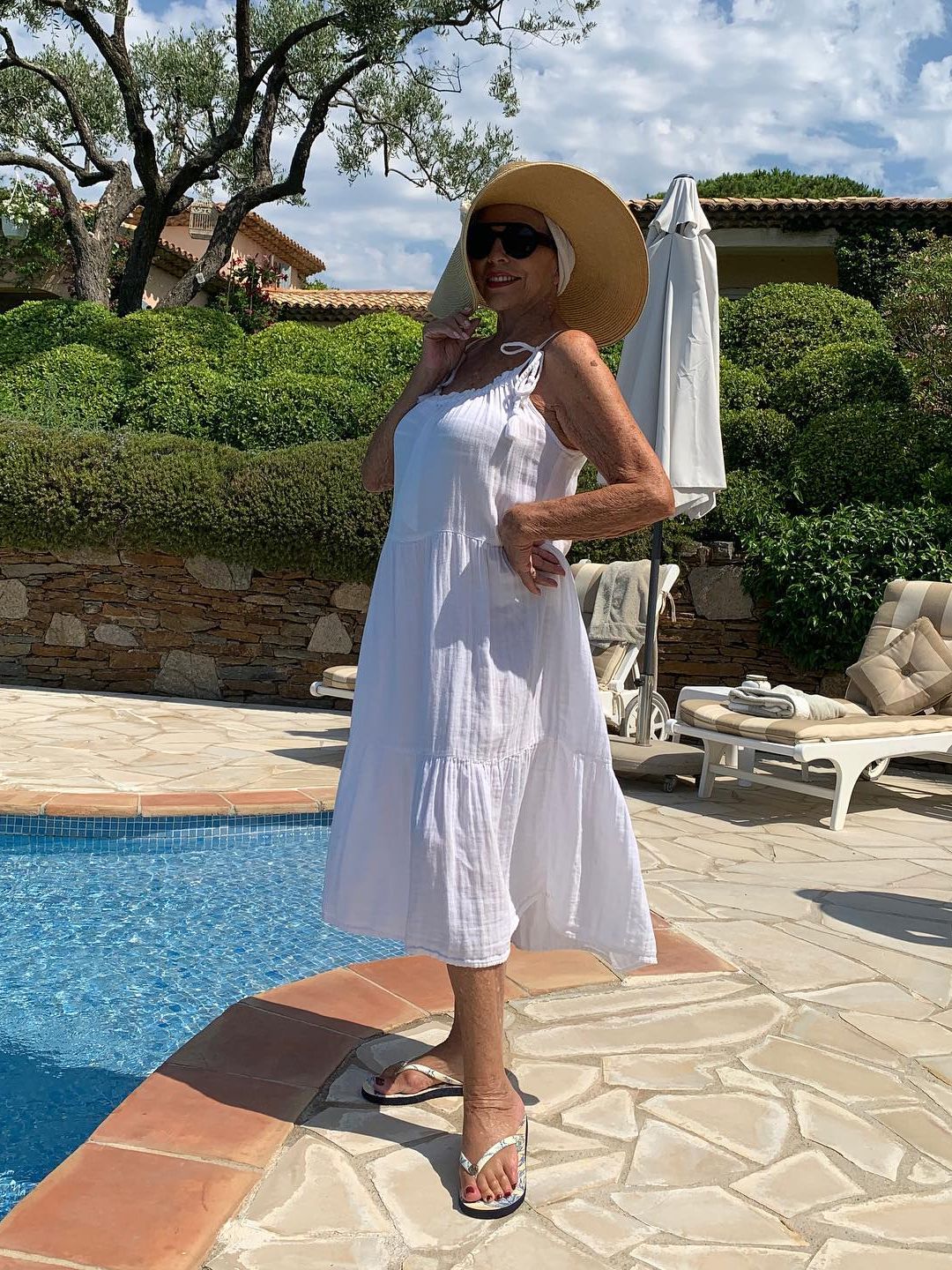 woman standing by swimming pool