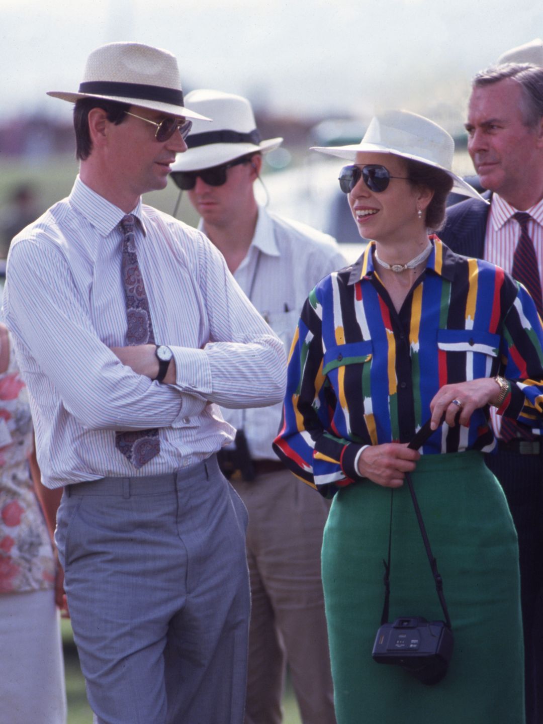 couple outisde in white fedora hats