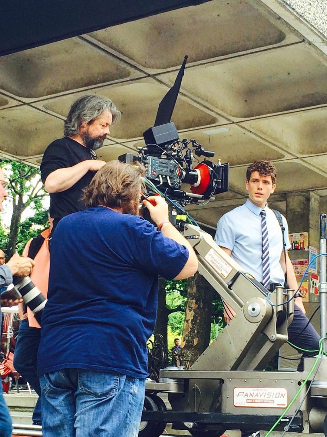 Austin next to the camera team on the set of his first movie