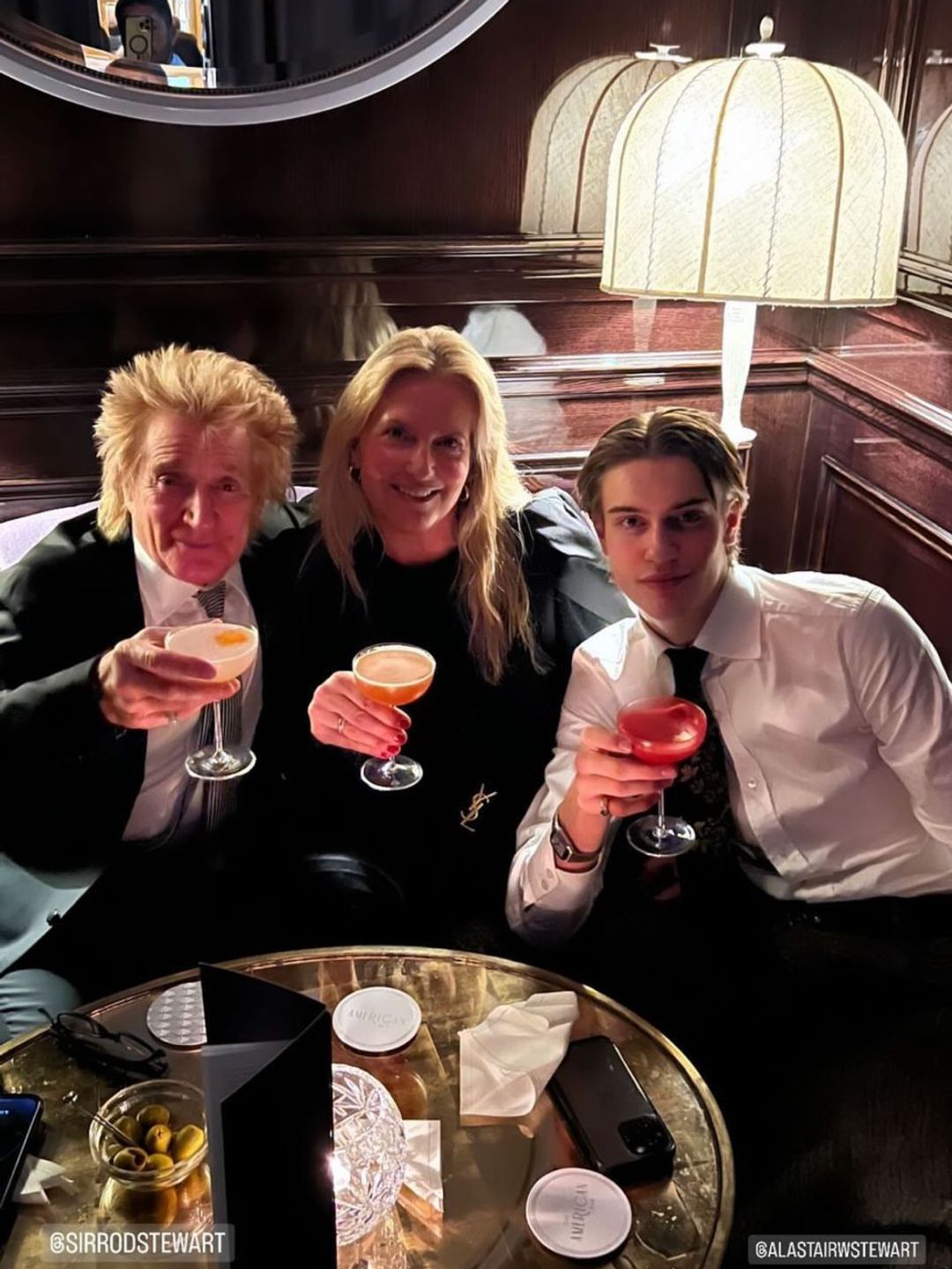 Penny Lancaster and Rod Stewart enjoy a cocktail with son Alastair