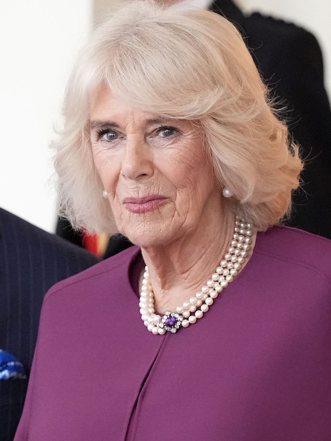 Britain's Queen Camilla reacts as she stands with Britain's King Charles III during a formal farewell for Qatar's Emir Sheikh Tamim bin Hamad al-Thani and his wife Sheikha Jawaher bint Hamad bin Suhaim al-Thani at Buckingham Palace in central London, on December 4, 2024, on the second day of the Emir's two-day State Visit to Britain. The Emir of Qatar and his wife are in the UK for a two-day State Visit, hosted by Britain's King