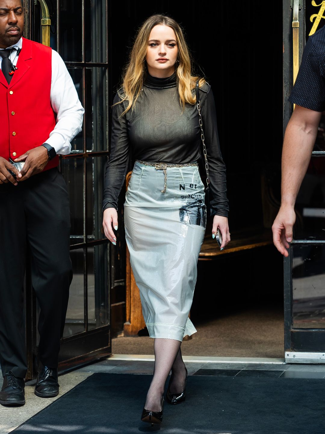 oey King is seen in the East Village on July 08, 2024 in New York City wearing a black turtleneck and a latex midi skirt