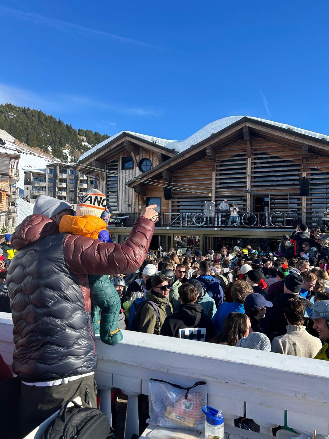 A father with his young baby partying at La Folie Douce in Avoriaz