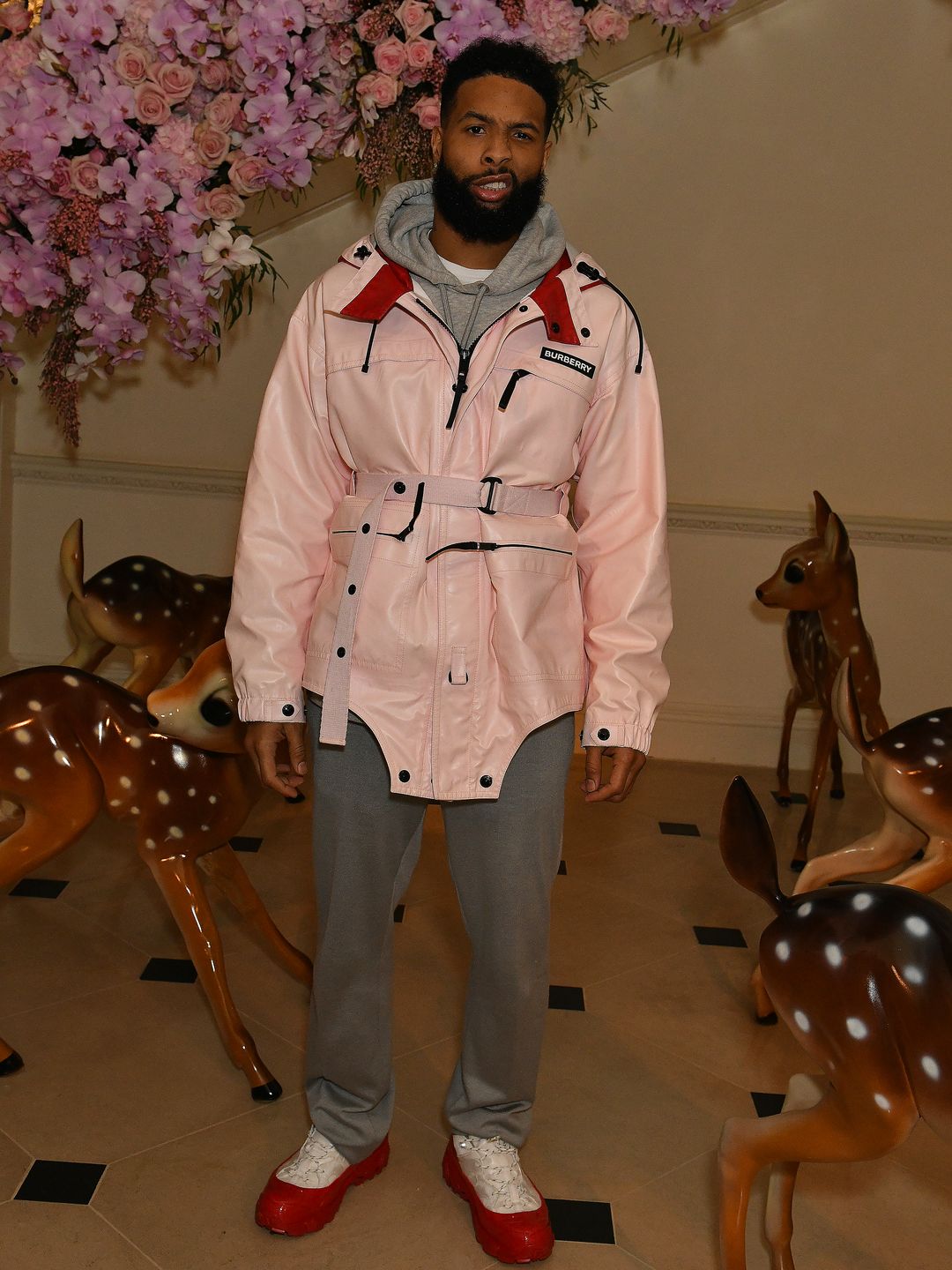 Odell Beckham Jr. attends the Burberry Autumn/Winter 2020 show after party in a pink Burberry raincoat